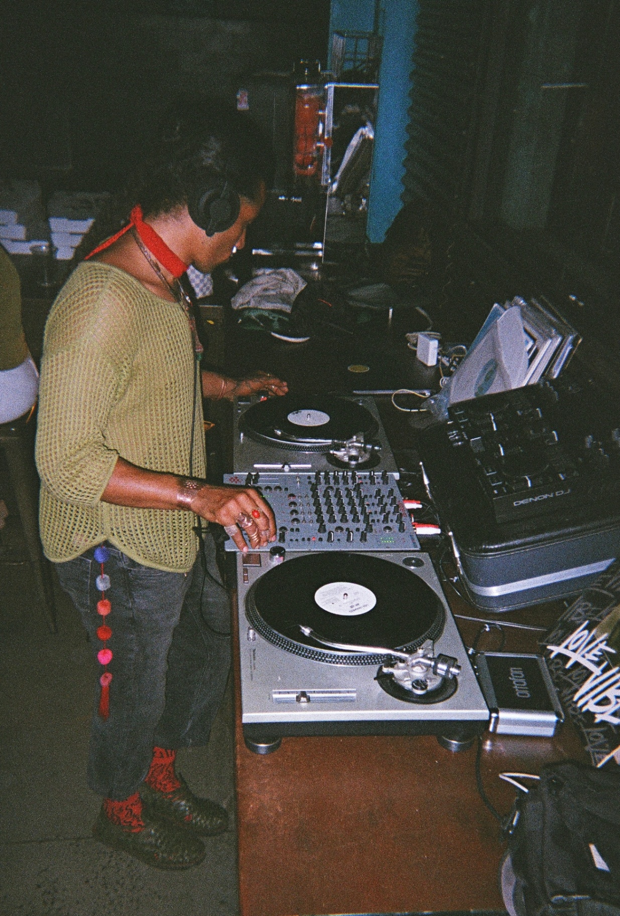 A DJ mixes on Technics decks in the venue